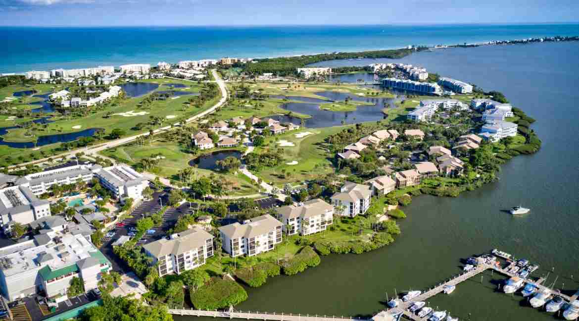 Aerial high IRP marina and riverfront by E