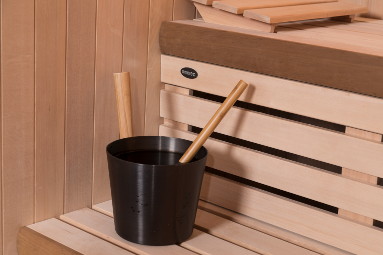 water bucket on a wooden sauna bench made by amerec